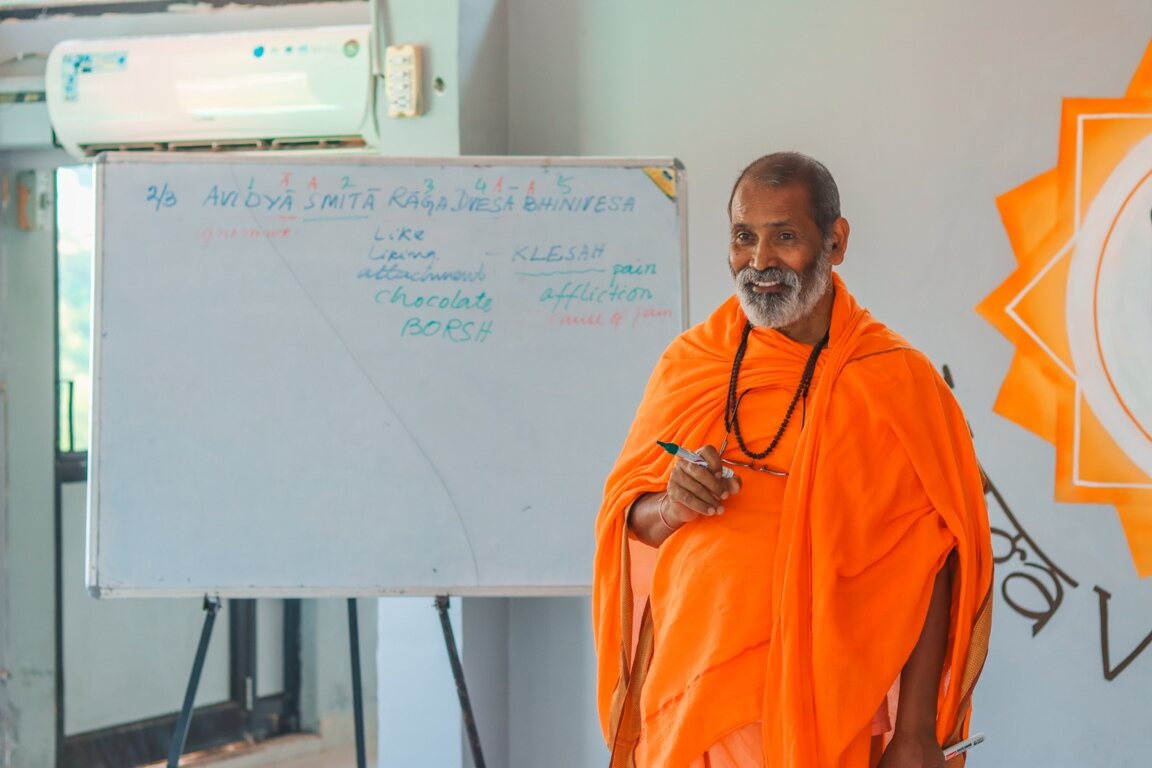 yoga teacher teaching yogA